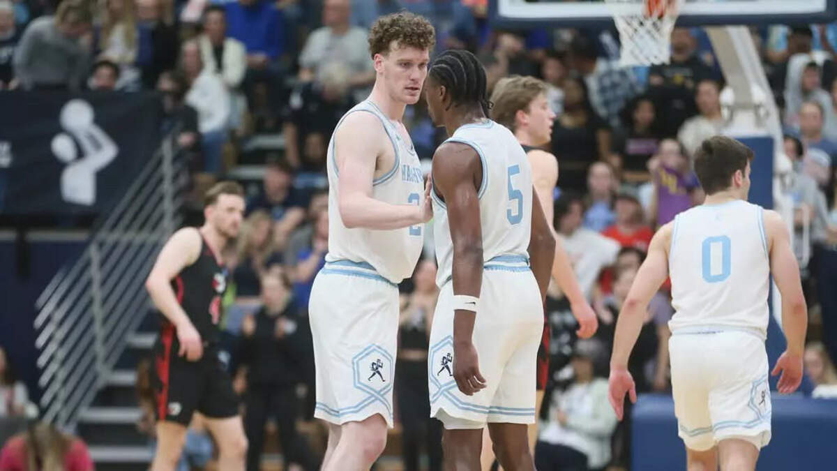 Washburn’s Andrew Orr (24) and Jacob Hanna (5) talk during a game against Minnesota State University Moorhead on March 24, 2025.