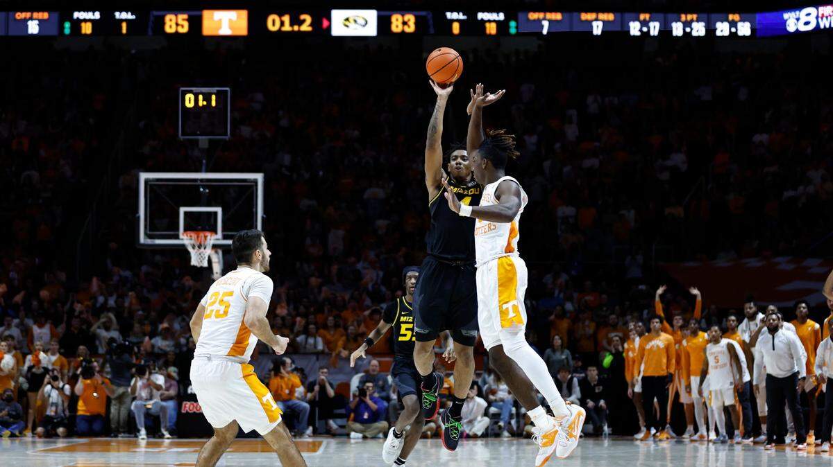 Tigers guard DeAndre Gholston drills a last-second three-point shot over Tennessee guard Jahmai Mashack to give Mizzou the upset win on Saturday, Feb. 11, 2023, in Knoxville, Tenn.