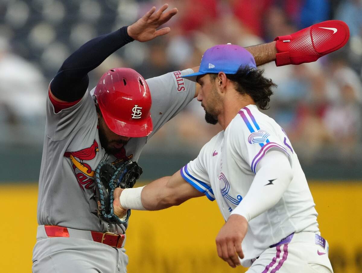 Royals first baseman Jac Caglianone, right, catches St. Louis Cardinals baserunner Iván Herrera in a third-inning rundown during a game at Kauffman Stadium in Kansas City on Friday, June 19, 2026.
