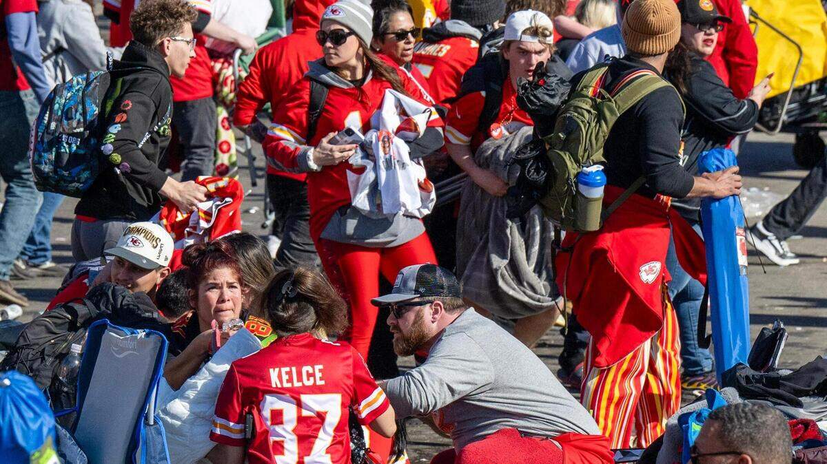 After shots rang, some Chiefs fans hunkered down while other rushed to leave he Kansas City Chiefs Super Bowl rally on Wednesday, Feb. 14, 2024, at Union Station in Kansas City.