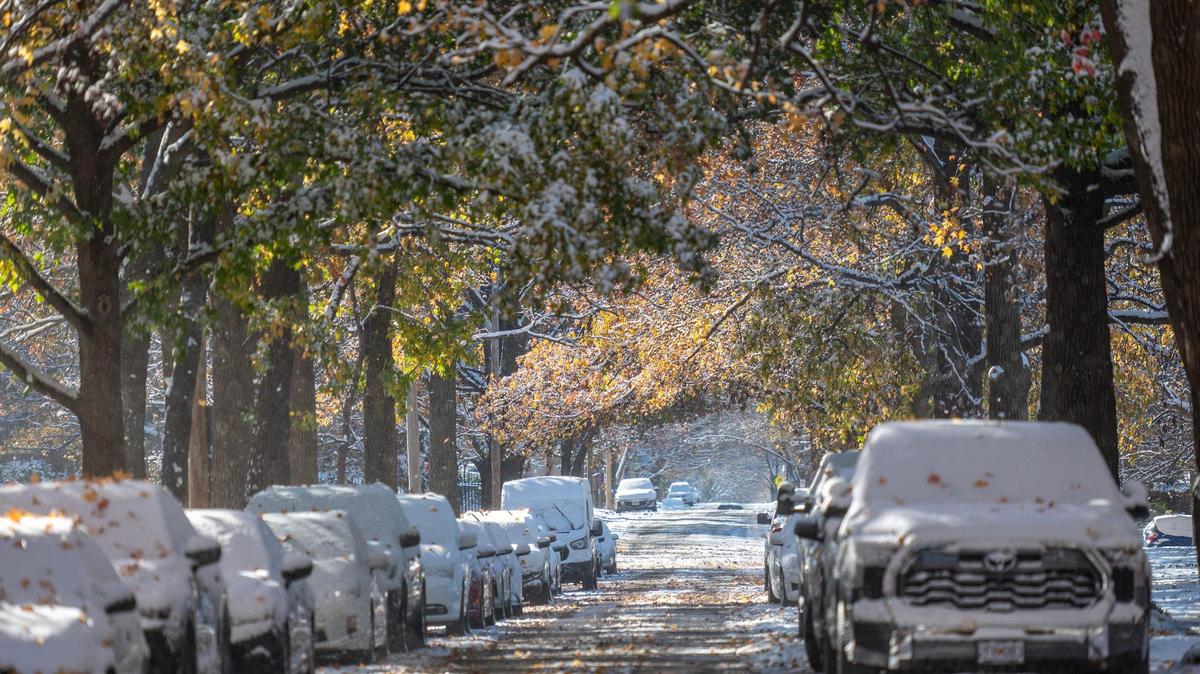 Snow blankets vehicles along Locust Street following Kansas City’s first snowfall of the season on Nov. 26.