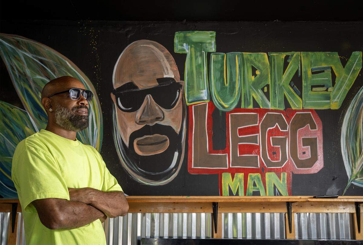 Matthew Montgomery, also known as “Turkey LeggMan," talks with a customer at his barbecue spot at 1916 Quindaro Blvd., in Kansas City, Kansas, on Thursday, Sept. 11. He specializes in smoked turkey legs.  