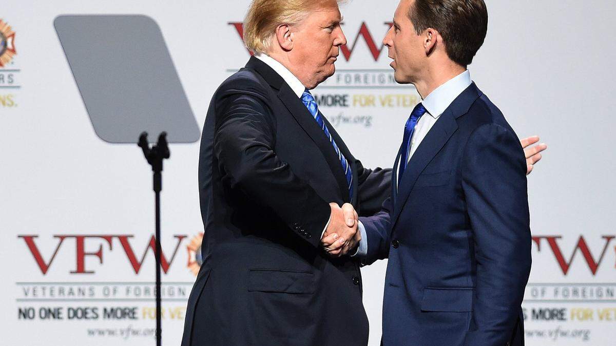 President Donald Trump shakes hands with Missouri Republican Josh Hawley during a 2018 visit to Kansas City. Hawley won election to the U.S. Senate months later.