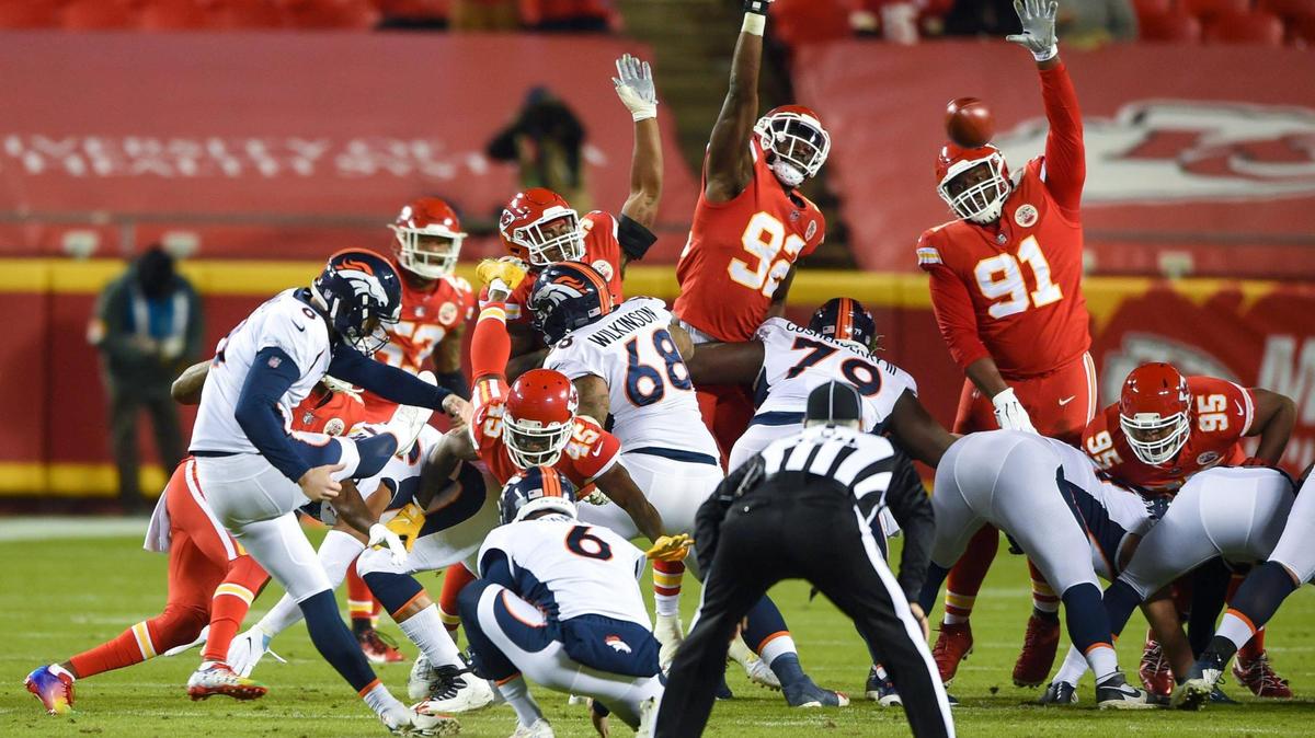 Denver Broncos kicker Brandon McManus (8) kicks a field goal despite block attempts from Kansas City Chiefs defensive end Tanoh Kpassagnon (92) and defensive tackle Derrick Nnadi (91) in the first-half against the Broncos at Arrowhead Stadium on Sunday, Dec. 6, 2020, in Kansas City. The Chiefs defeated the Broncos, 22-16.