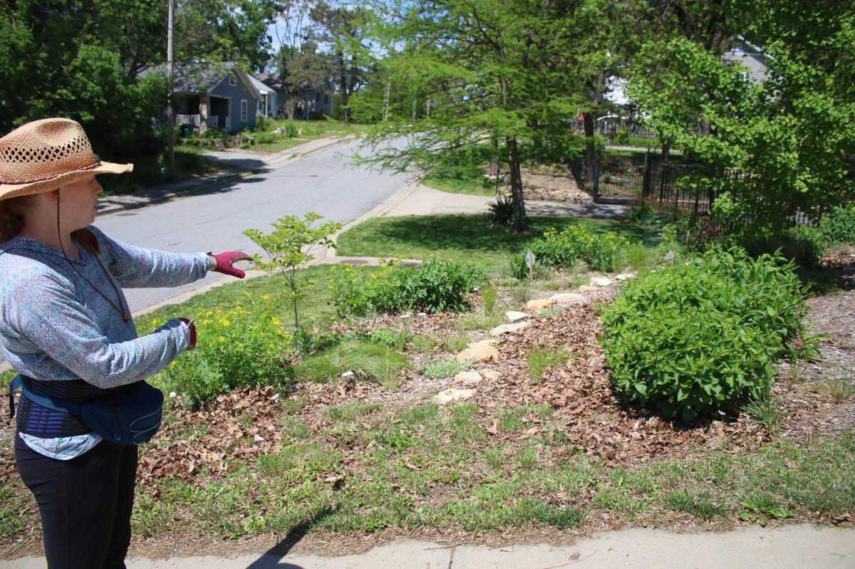 Roeland Park resident Melissa Castillo points out some of the work she’s done in her yard that has qualified for reimbursement through the Contain the Rain program.