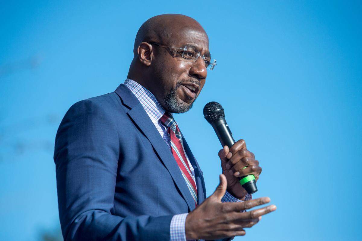 Georgia Democratic senate candidate Raphael Warnock speaks during a campaign rally in Augusta, Ga., Monday, Jan. 4, 2021. Democrats Jon Ossoff and Warnock are challenging incumbent Republican Senators David Perdue and Kelly Loeffler in a runoff election on Jan. 5. (Michael Holahan/The Augusta Chronicle via AP)