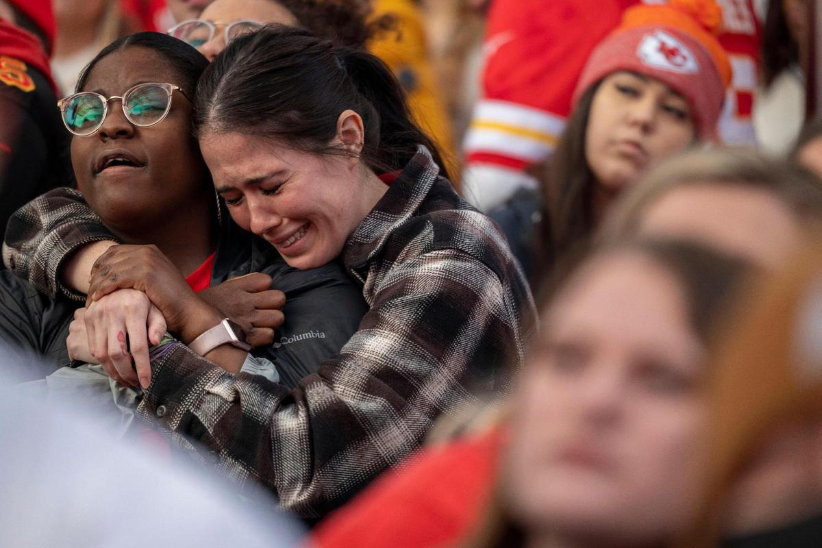Kansas City Chief fans Florence Wallace, left, and Jordyn Galvin react to the final score of the AFC Championship game against the Cincinnati Bengals at a watch party at Power and Light District in Kansas City on Sunday, Jan. 30, 2022.