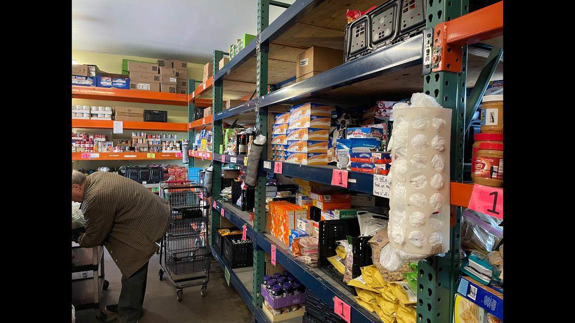 Volunteers work shifts at the New Hope Food Pantry in Olathe to help gather food and load it into vehicles.