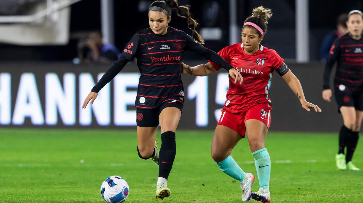 KC Current midfielder Desiree Scott, right, defends Portland Thorns forward Sophie Smith during the NWSL championship game at Audi Field in Washington D.C.
