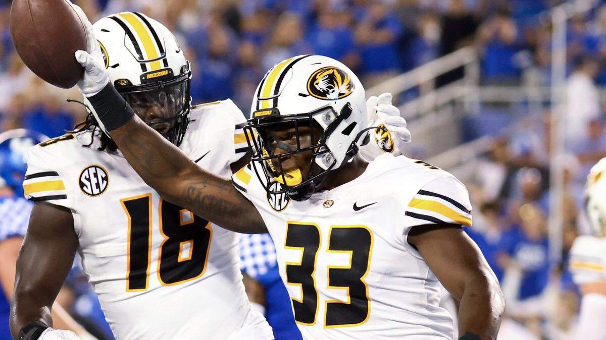 Missouri linebacker Chad Bailey picks up a Kentucky fumble near the end zone during the first half in Lexington, Ky., Saturday, Sept. 11, 2021.