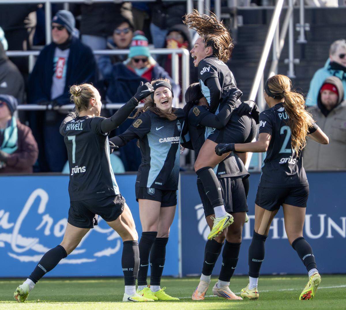 Gotham FC players celebrate after scoring a goal against the KC Current during an NWSL quarterfinal playoff match at CPKC Stadium in Kansas City on Sunday, Nov. 9, 2025.