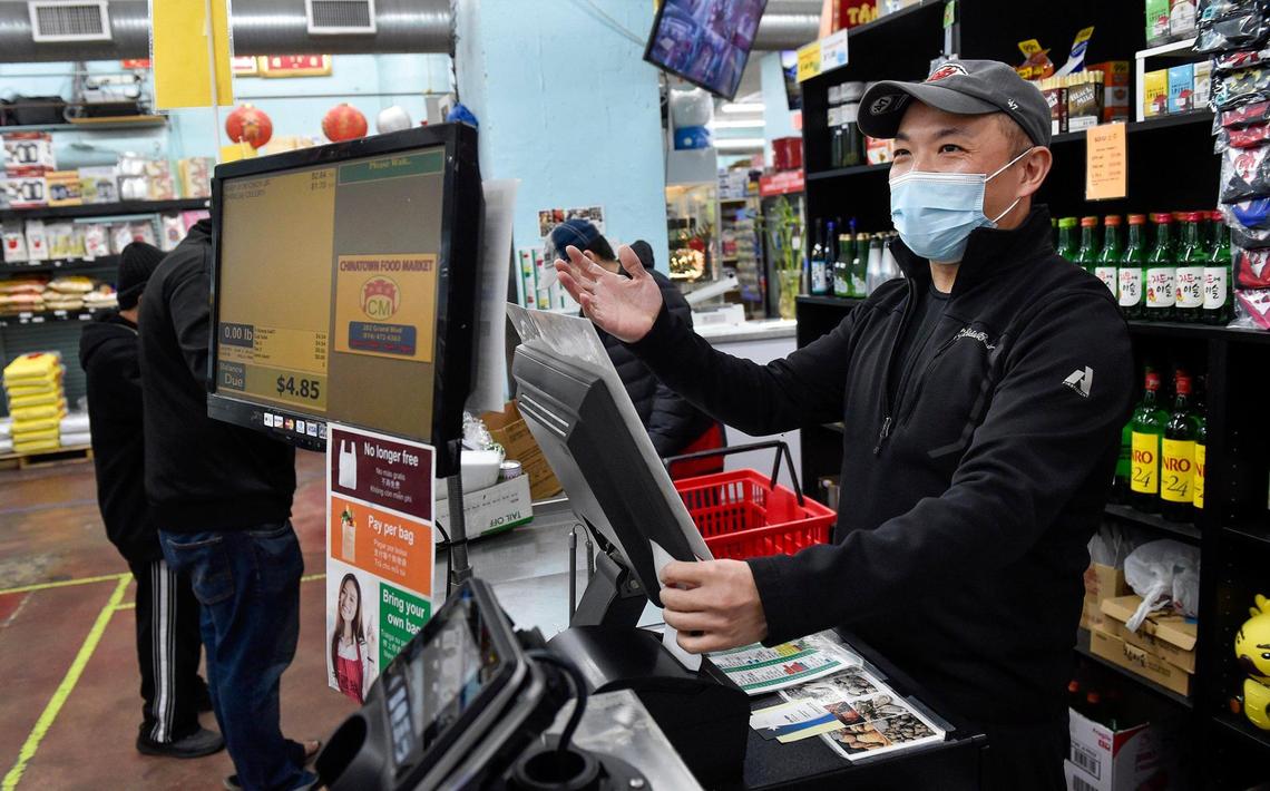 Donny Lo, 39, manager of Chinatown Food Market in the River Market, works the checkout line when employees go on break. His mother, Karen Lo, started the market in 1995, but after a decade relocated to the current location. He applauds the recent rise in Asian activism: “If you don’t speak out,” he said, “people might just take your silence for consent.”