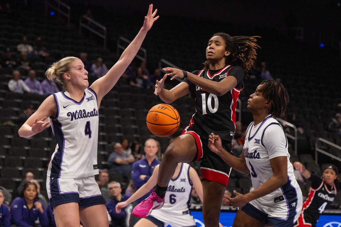 Kansas State defenders strip the ball from Cincinnati Bearcats forward Kylie Torrence (10) during the first half of the Wildcats’ first-round game vs. the Cincinnati Bearcats.