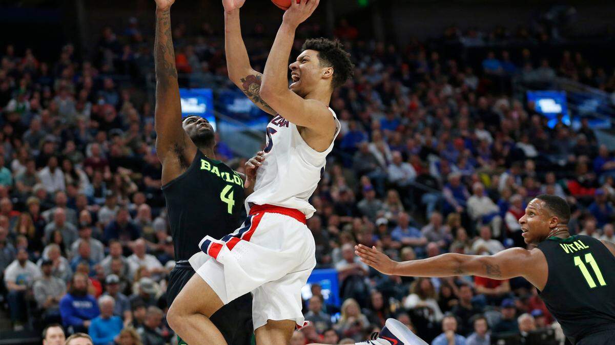 Gonzaga forward Brandon Clarke, center, goes to the basket as Baylor’s Mario Kegler (4) and Mark Vital (11) defend during the second half of a second-round game in the NCAA men’s college basketball tournament Saturday, March 23, 2019, in Salt Lake City. (AP Photo/Rick Bowmer)
