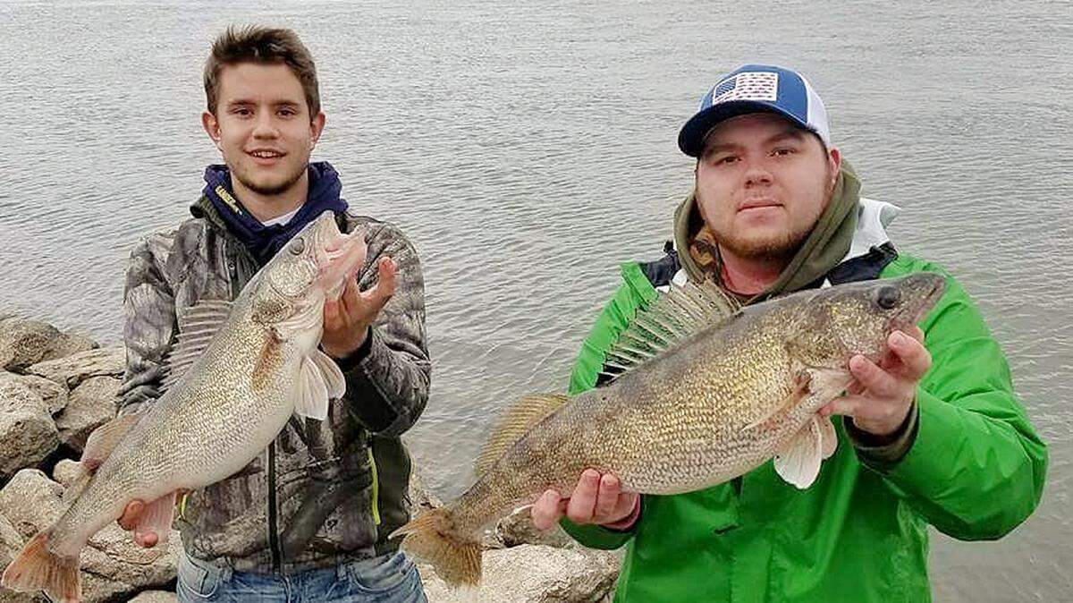 Forest Brown, left, and Tyler Albrecht show off some nice walleye caught below Truman Dam.