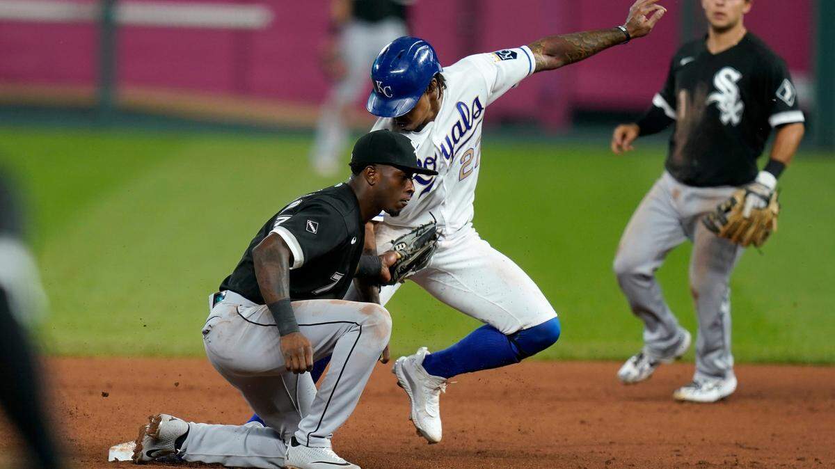 Kansas City Royals’ Adalberto Mondesi (27) arrives before the tag by Chicago White Sox shortstop Tim Anderson (7) for a stolen base during the fourth inning of a baseball game at Kauffman Stadium in Kansas City, Mo., Friday, Sept. 4, 2020. (AP Photo/Orlin Wagner)