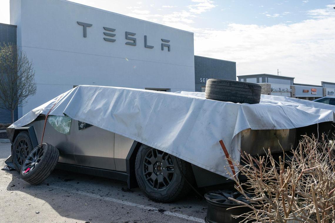 Fire-damaged Tesla Cybertrucks remain covered at a Tesla dealership on March 18 in Kansas City. Fire crews responded to the dealership at 10111 State Line Road the night before to extinguish the blaze.