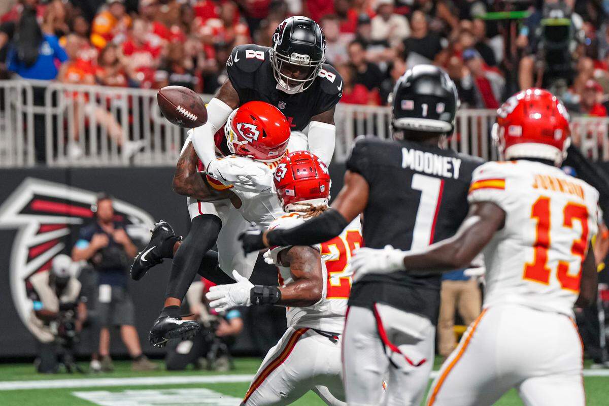 Kansas City Chiefs safety Bryan Cook (6) breaks up a pass against Atlanta Falcons tight end Kyle Pitts (8) in the end zone during the second half at Mercedes-Benz Stadium.
