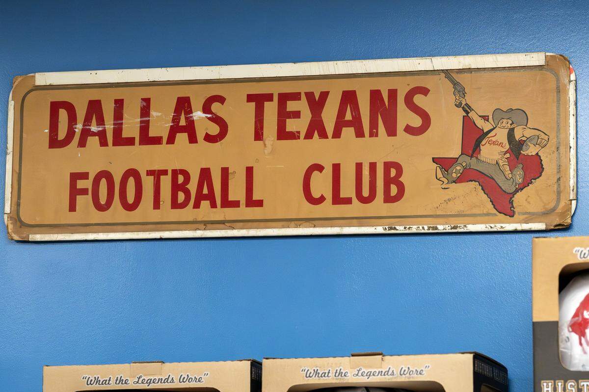 A sign featuring the old Dallas Texans logo is seen inside the Library Room at the Kansas City Chiefs' underground storage facility in Kansas City.