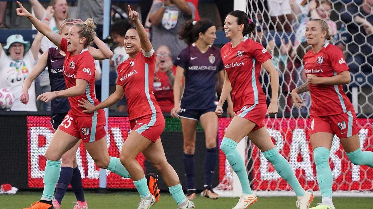 Kansas City Current forward Kristen Hamilton (25), midfielder Lo LaBonta (10) and forward Cece Kizer (5) celebrate after a goal during the first half against the North Carolina Courage at Children’s Mercy Park on June 3, 2023.
