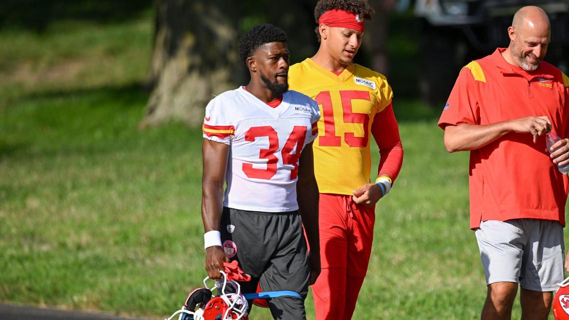 Chiefs rookie defensive back Brandin Dandridge (34) walks to the the field alongside quarterback Patrick Mahomes during training camp on Saturday, July 24, 2022 at Missouri Western State University in St. Joseph, Missouri.