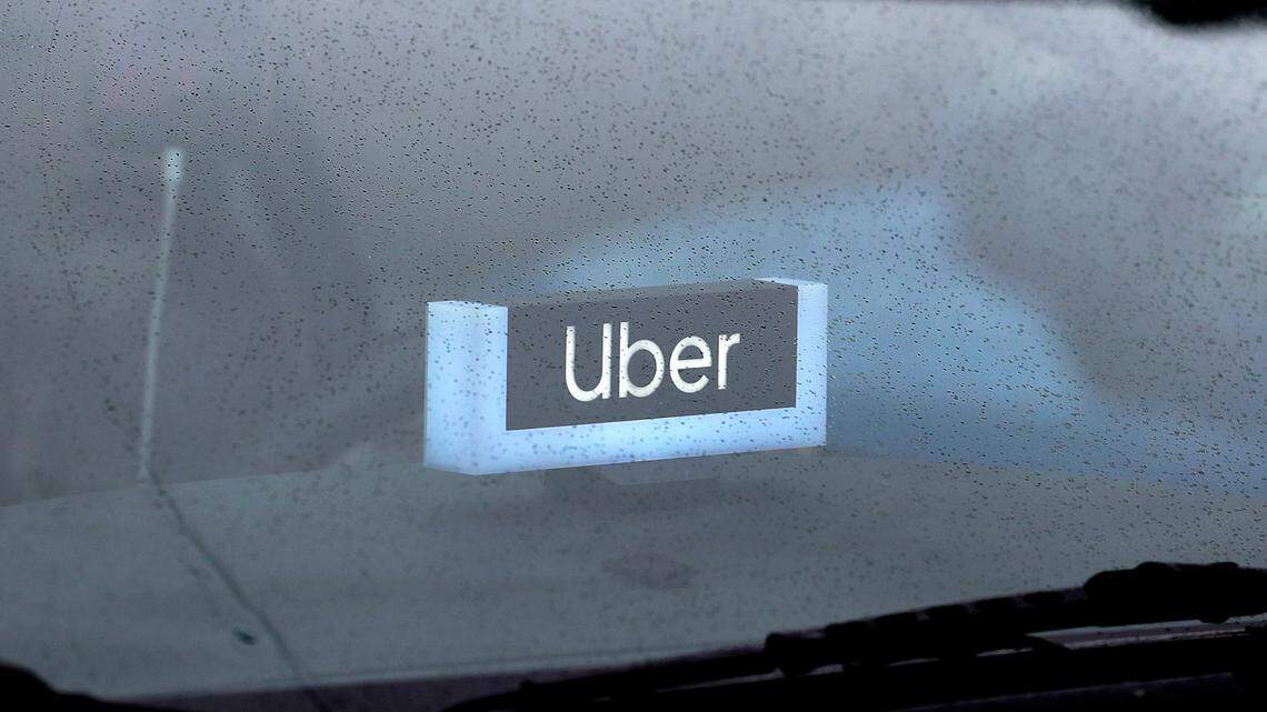 An Uber driver is accused of assaulting a 73-year-old passenger after a request to stop texting and driving, Texas officials say.