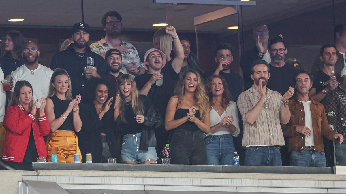 Taylor Swift, actor Ryan Reynolds, actor Hugh Jackman and friends celebrates after a Kansas City Chiefs touchdown during a game last year at MetLife Stadium.