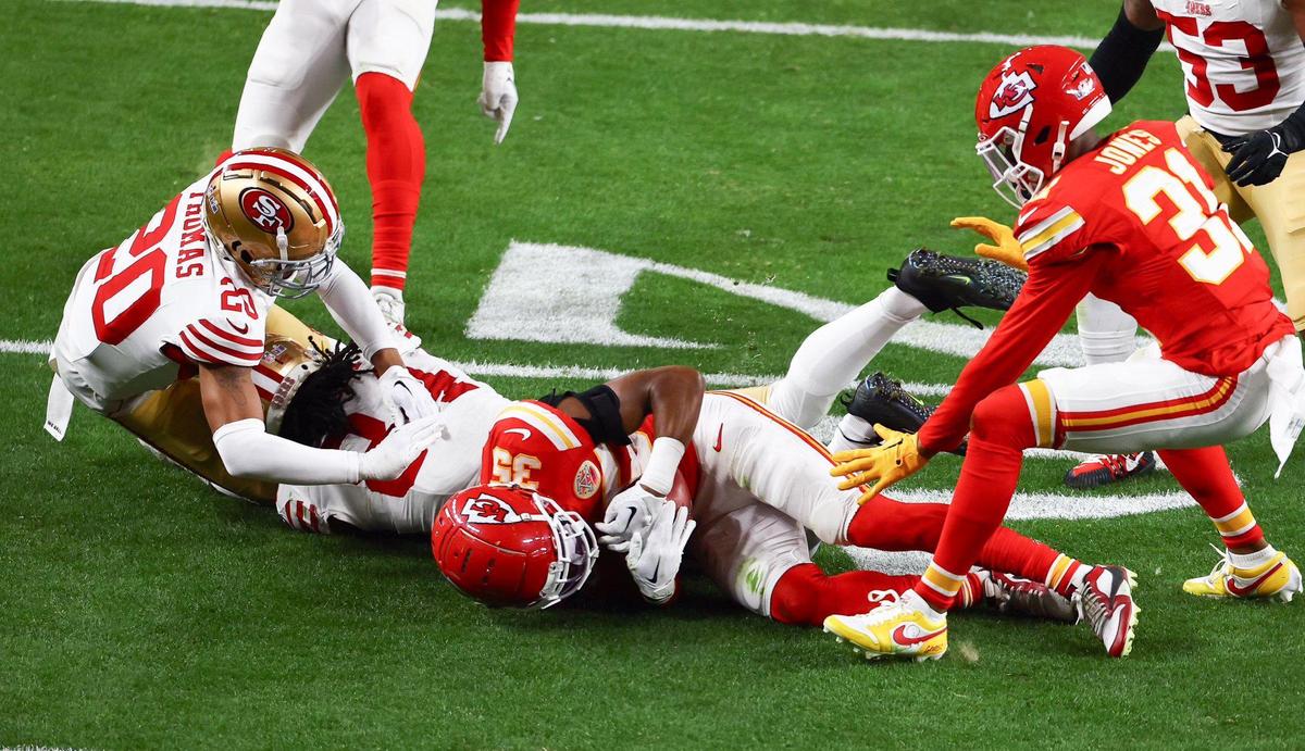 Kansas City Chiefs cornerback Jaylen Watson (35) recovers a fumbled punt return attempt by the San Francisco 49ers in the second half of Super Bowl LVIII, Sunday, Feb. 11, 2024, in Las Vegas.