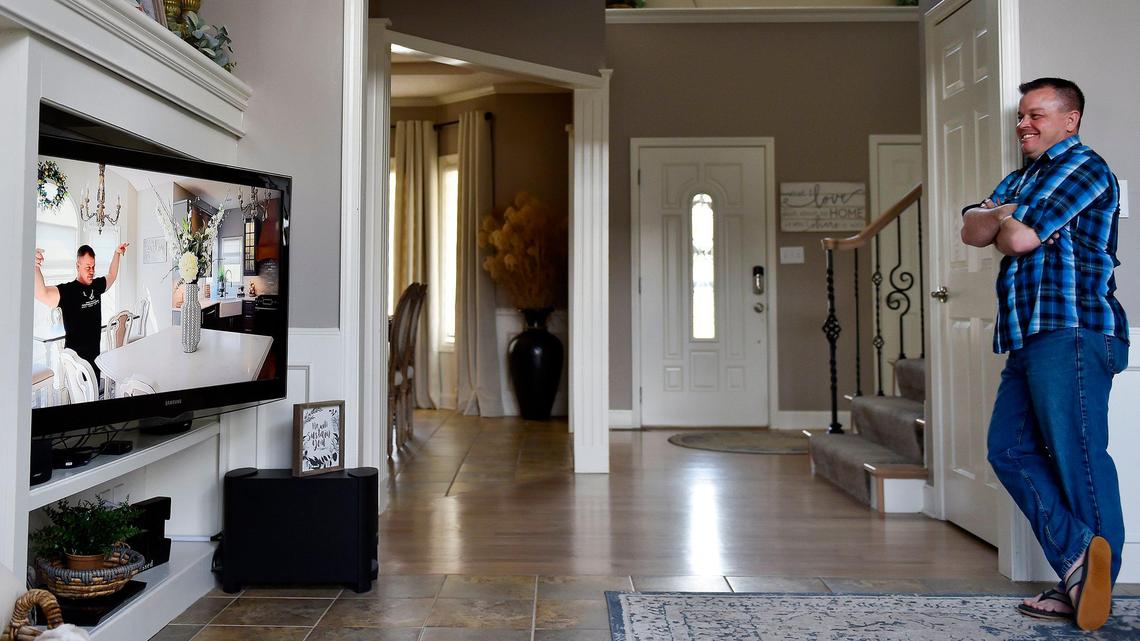 Jason Weiser of Bonner Springs watches himself on an episode of “A Charming Abode.”