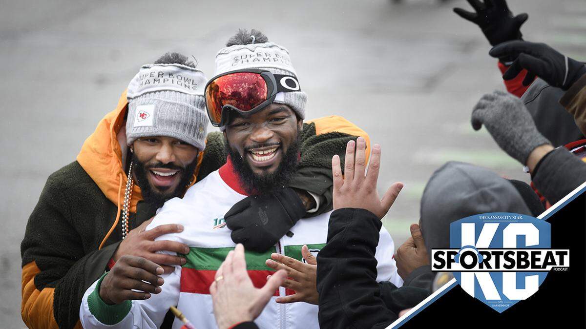 Kansas City Chiefs safety Jordan Lucas, left, and running back Damien Williams party with the crowd during the Super Bowl parade through downtown Kansas City.