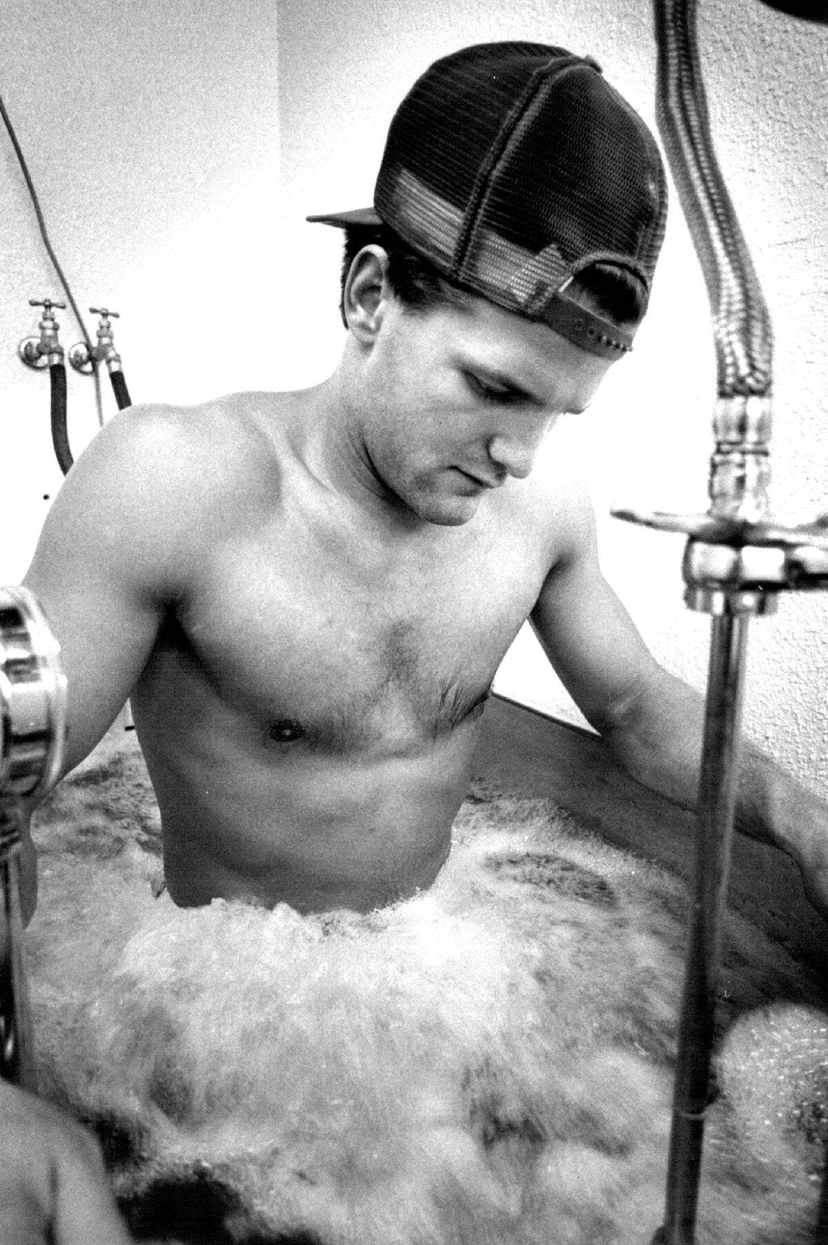 Chiefs’ punter Bob Grupp takes a whirlpool treatment while trying to overcome a thigh injury in 1981.