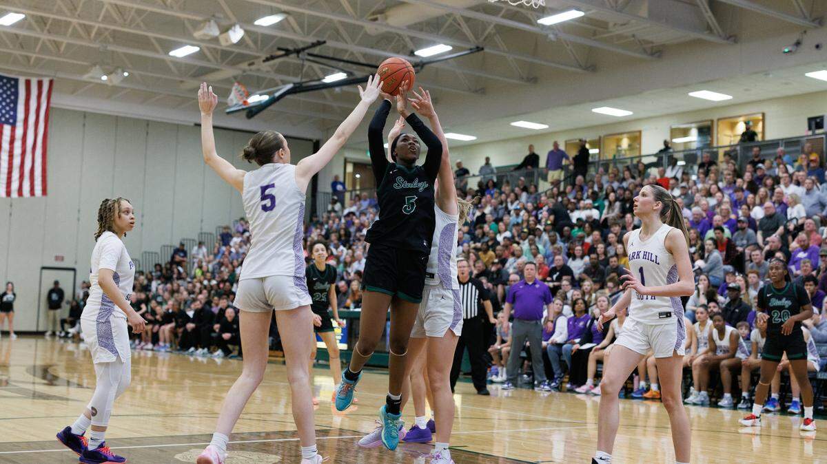 Staley’s Destiny Manyawu attempts a shot in the Falcons’ 51-43 win over Park Hill South on March 11, 2025.