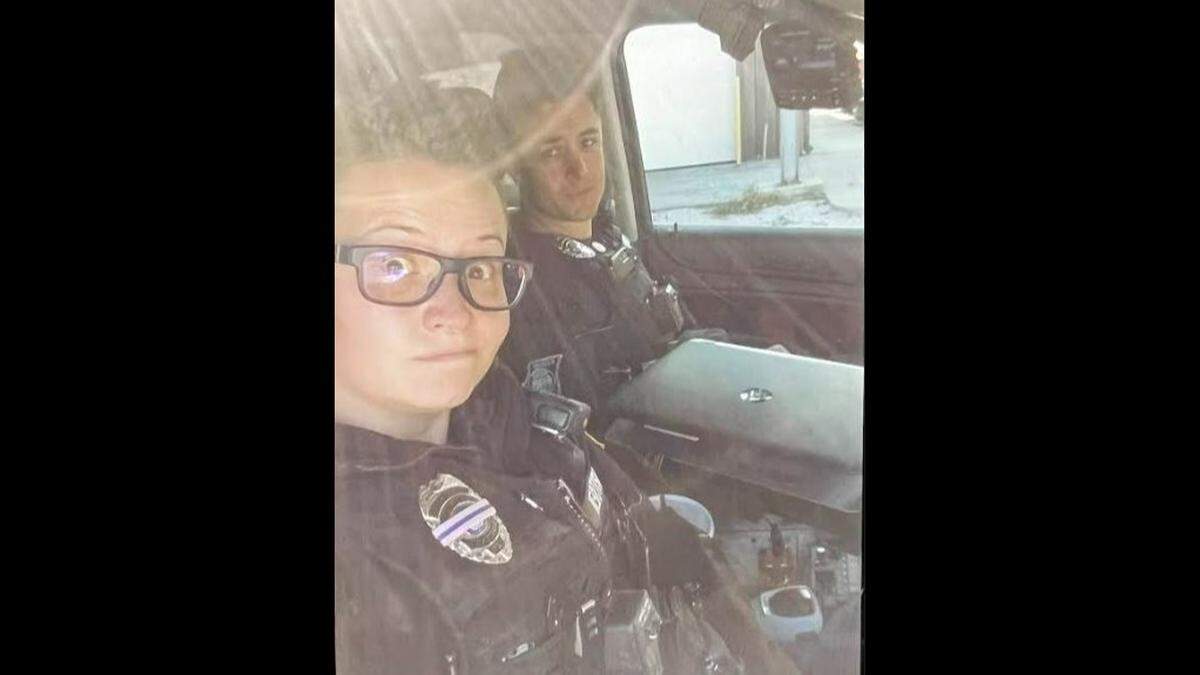 Kaitlyn Lauritsen and Jonah Oswald pose for a selfie while officers at the Buckner Police Department, after Oswald joined the force in 2018.