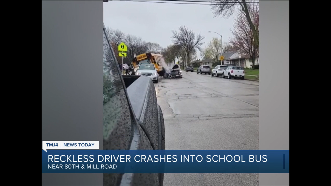 A stolen vehicle crashed into the back of a school bus, leaving two people injured in Milwaukee, Wisconsin, police say.