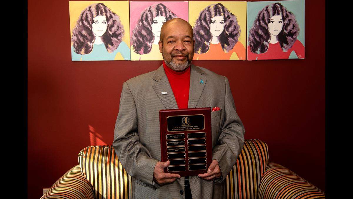 Broderick Crawford, Kansas City, Kansas community activist, died at the age of 61. He’s pictured holding a 2020 Cancer Survivor’s Day Community Impact Award.