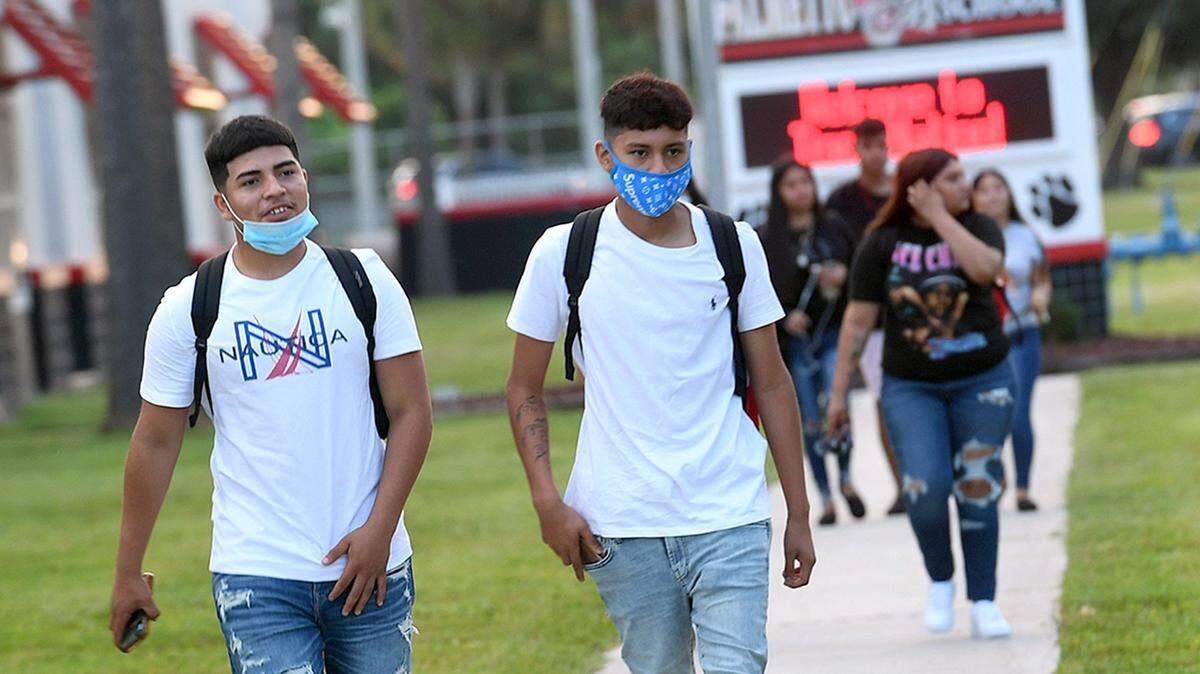 These students in Florida returned to school with a new “normal” of mask-wearing and social distancing. Even kids who start the year at home need to get some essential school supplies..