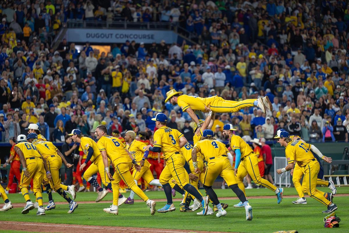 Savannah Bananas players celebrate after defeating the Firefighters during a Banana Ball game at Kauffman Stadium on Friday, May 23, 2025, in Kansas City.