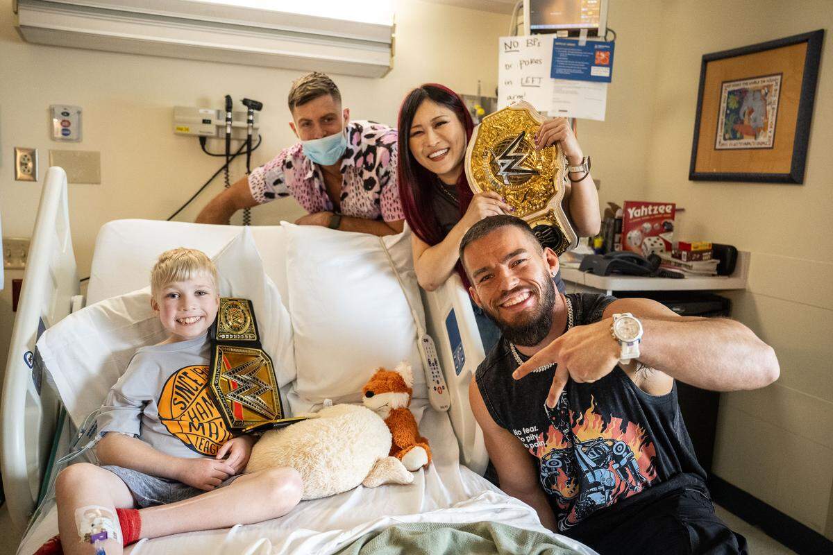 From left to right: WWE superstars Grayson Waller, Iyo Sky and Austin Theory visited kids inside Children’s Mercy Adele Hall campus for over an hour Monday, April 28 ahead of Monday Night Raw in Kansas City.