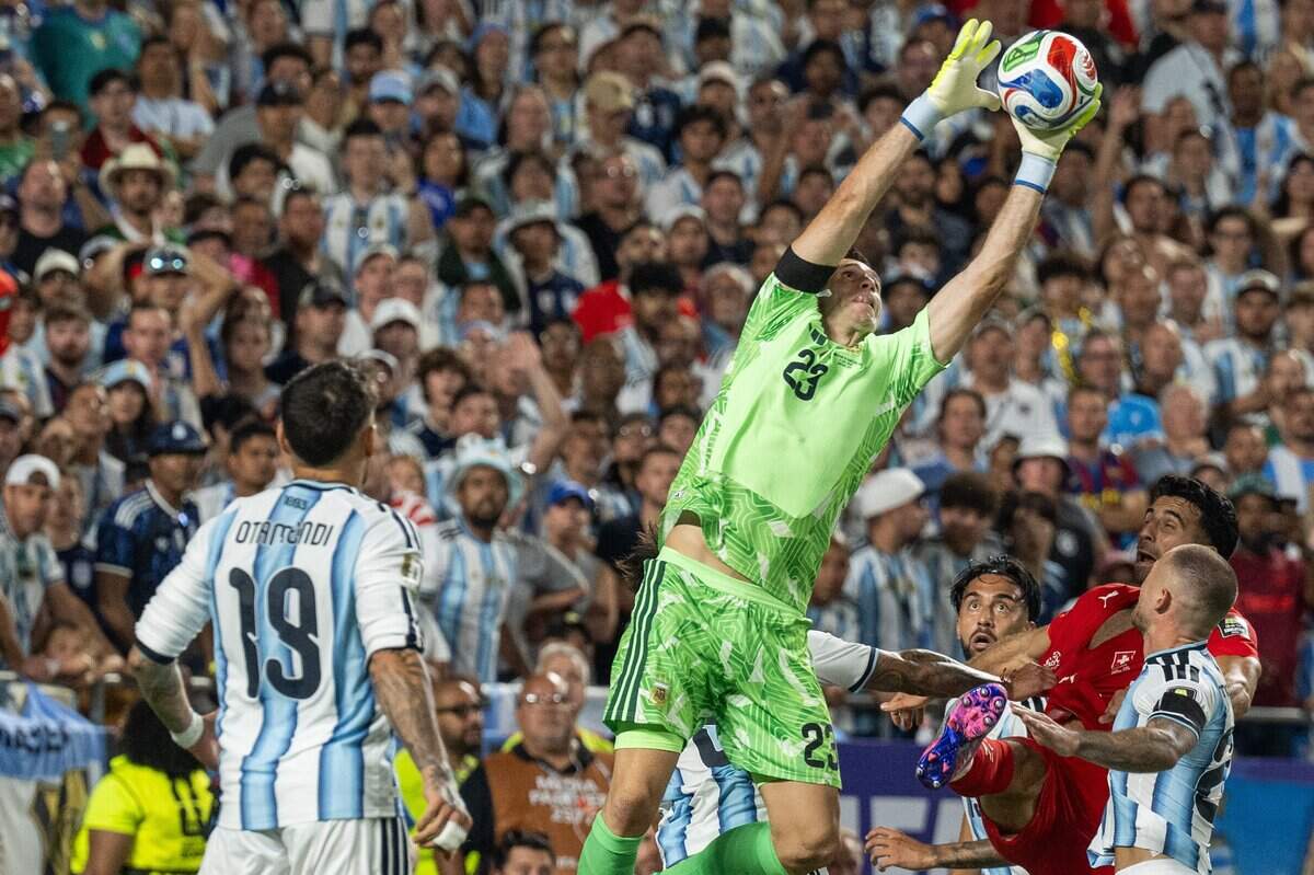 Argentina goalkeeper Emiliano Martínez (23) makes a save in a 2026 FIFA World Cup quarterfinal match at Kansas City (Arrowhead) Stadium in Kansas City on Saturday, July 11, 2026.