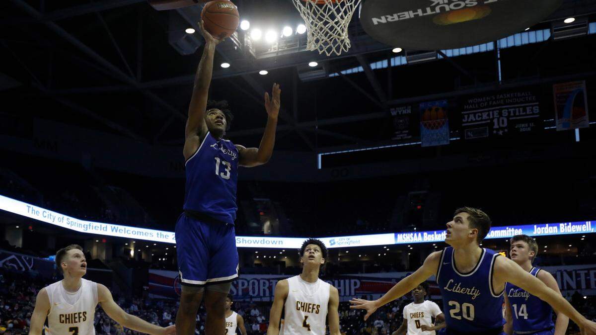 Liberty could not overcome Kickapoo in the Class 6 State Championship game. Liberty’sDavion Byers ( 13) breaks free for a layup.