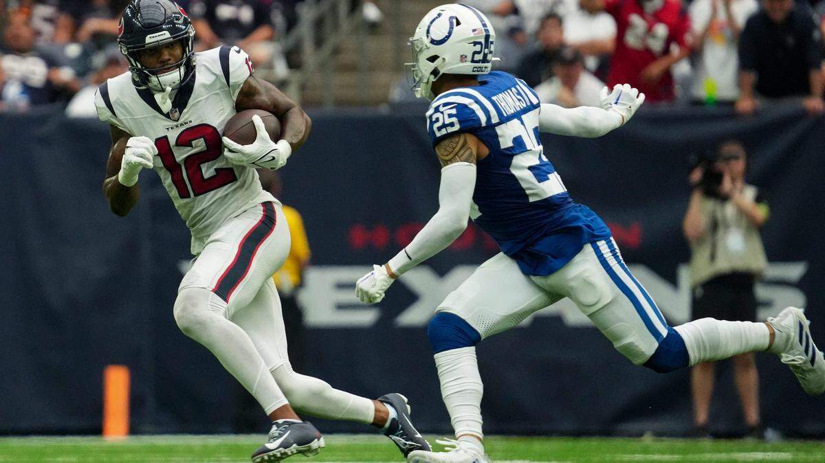Houston Texans wide receiver Nico Collins (lefgt) evaded Indianapolis Colts safety Rodney Thomas II during a game on Sept. 17, 2023, at NRG Stadium in Houston.