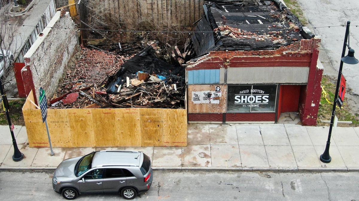 Plywood barricades surround the historical House of Hits building at 1511-13 E. 18th Street in the 18th & Vine Historic District. Contractors were reviewing the damage to determine the next steps. In 2017 strong winds had caused a partial collapse of the building but it was hoped that the facade could be saved.