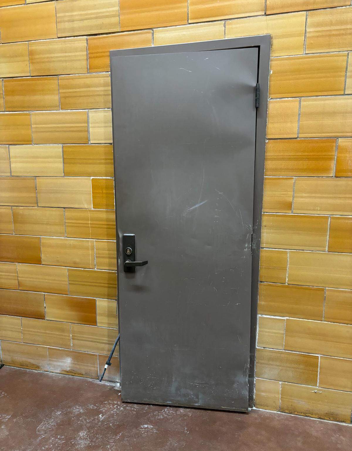 A door to a closet beneath a stairwell was damaged while firefighters hunted for the source of smoke that was filling Wyandotte High School’s auditorium with smoke. Inside the closet, firefighters found a plastic cleaning cart smoldering. Firefighters quickly extinguished the smoldering fire using a fire extinguisher.