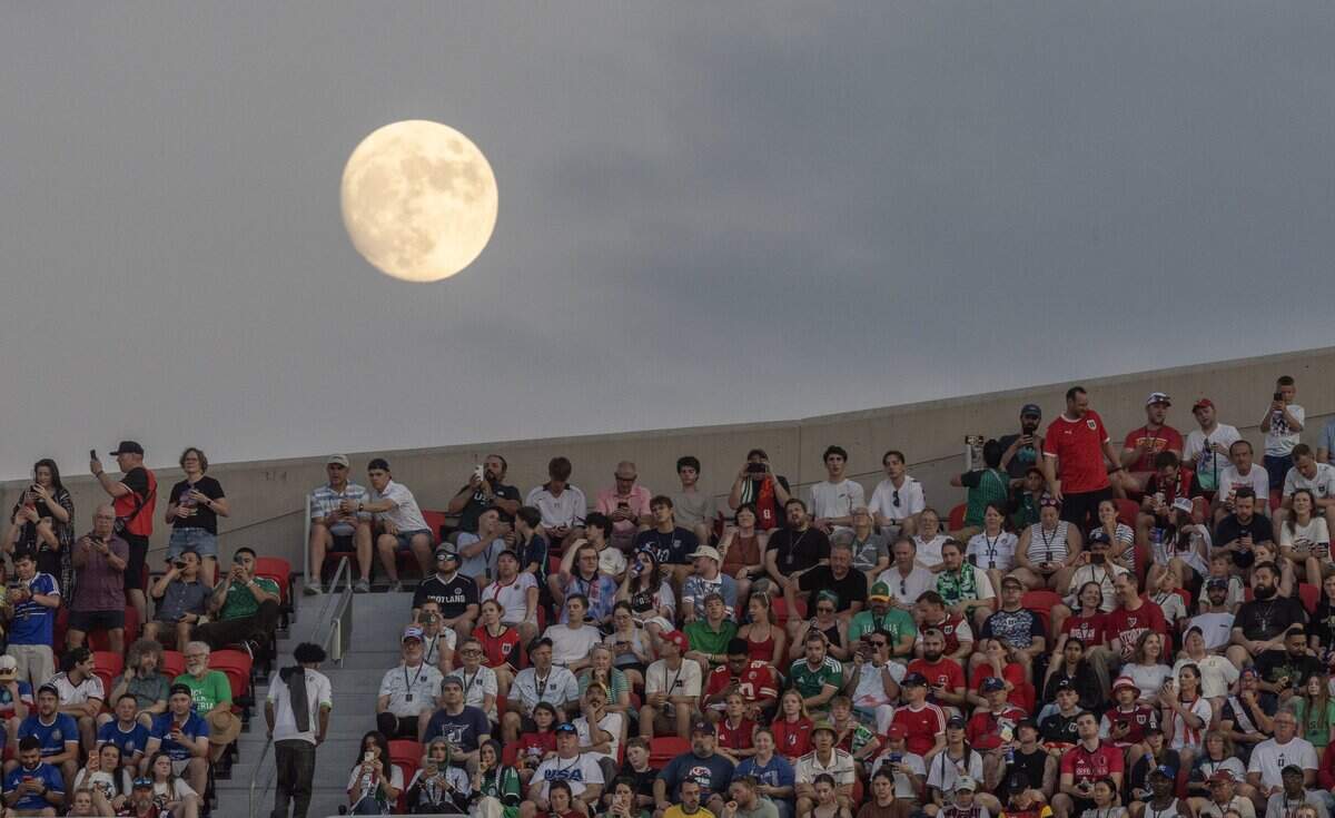 A full moon rises over Kansas City (Arrowhead) Stadium in Kansas City on Saturday, June 27, 2026.
