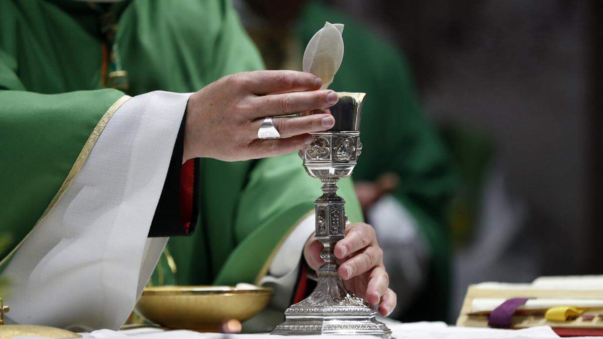 catholic church priest altar communion host sacrament