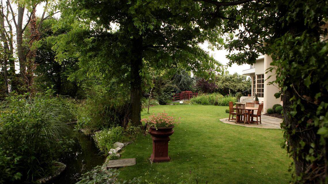 An outdoor garden with a patio.