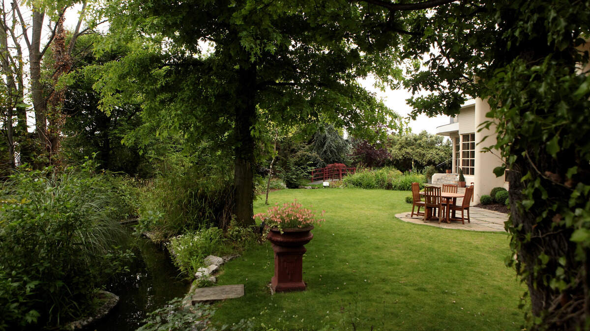 An outdoor garden with a patio.
