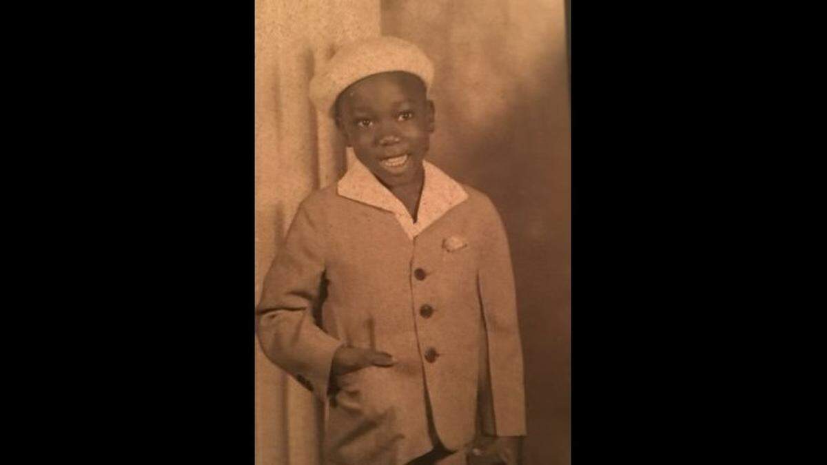 Henry Miller Jr. smiles in this childhood photo. When he was around 13, a plane crashed across the street from him, and he helped one of his friends get to safety.