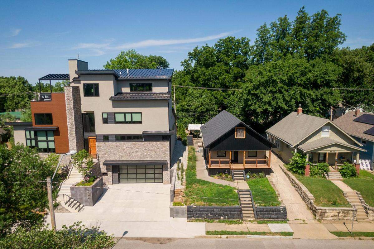 Traditional bungalows built in 1915, center, and 1903, right, are being torn down in the West Plaza neighborhood and replaced with large, multi-story modern homes.