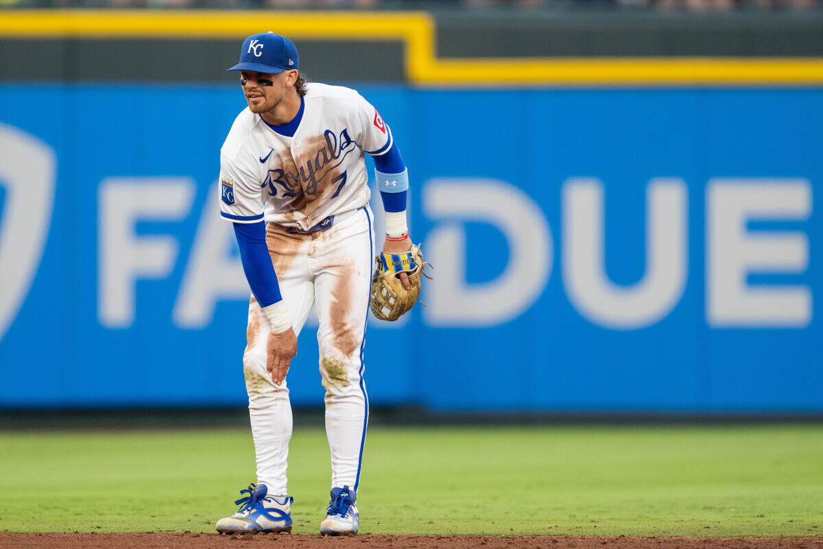 Royals shortstop Bobby Witt Jr. massages his leg after getting hurt while fielding a grounder during the fourth inning of a game against the St. Louis Cardinals at Kauffman Stadium in Kansas City on Thursday, June 18, 2026.